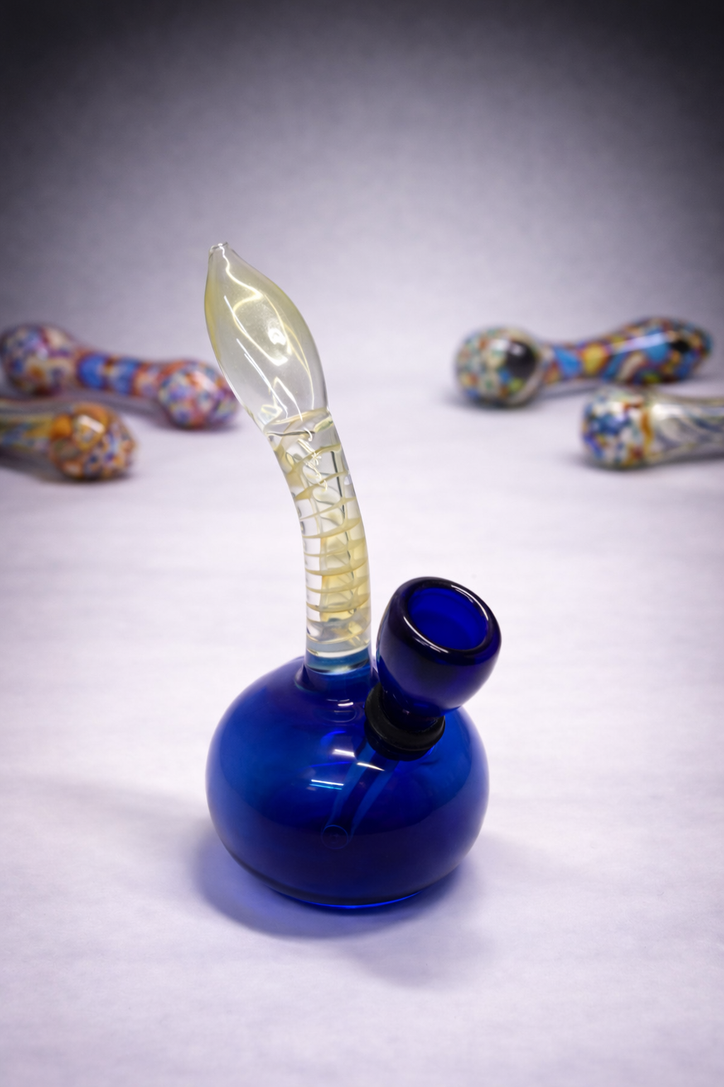 Colorful glass pipes and blue bubbler
